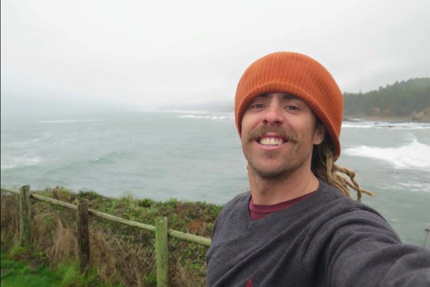 Adam Coleman takes a 'selfie' in front of the ocean.