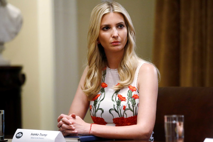 Ivanka Trump sits a table