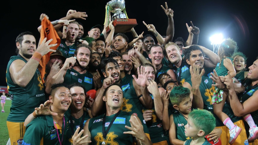 Group shot of the St Marys football team celebrating with the premiership cup after the 2017 grand final.
