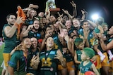 Group shot of the St Marys football team celebrating with the premiership cup after the 2017 grand final.