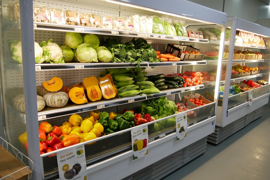 An aisle of colourful fruit and vegetables
