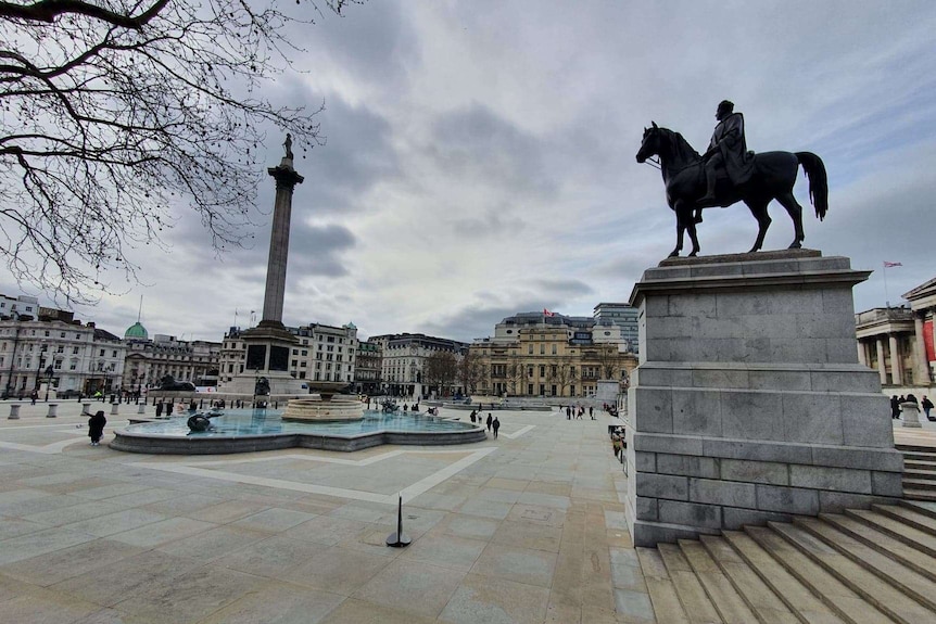 Trafalgar Square with just a smattering of people visible.