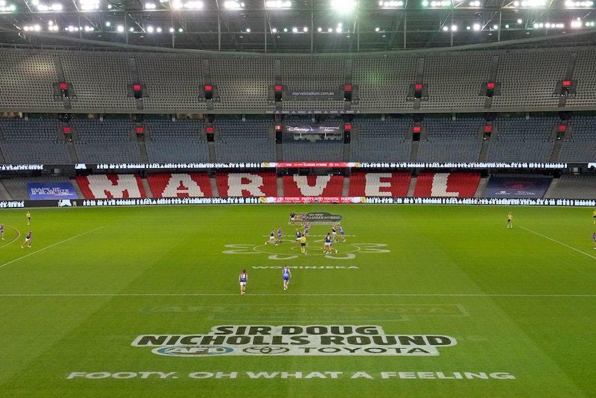 A general view of the opening bounce in an empty Docklands stadium during a round-11 AFL match.