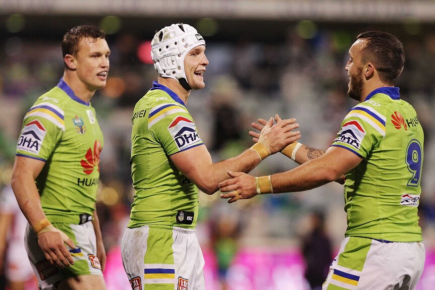 Try time ... Jarrod Croker (L) is congratulated by Josh Hodgson after touching down for the Raiders
