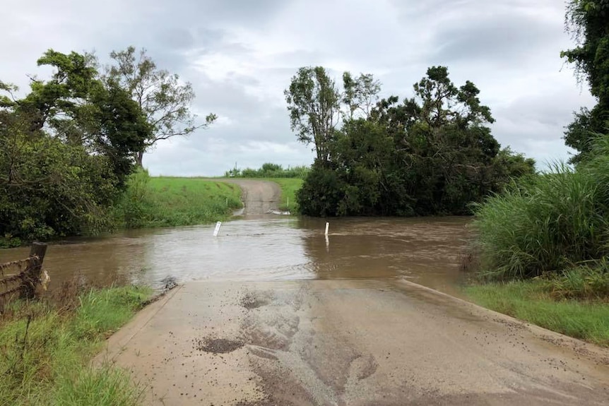 Gregory River, north of Proserpine, in north Queensland, floods over the causeway on afternoon of April 2, 2018 at Collingvale