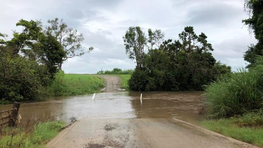 Gregory River, north of Proserpine, in north Queensland, floods over the causeway on afternoon of April 2, 2018 at Collingvale