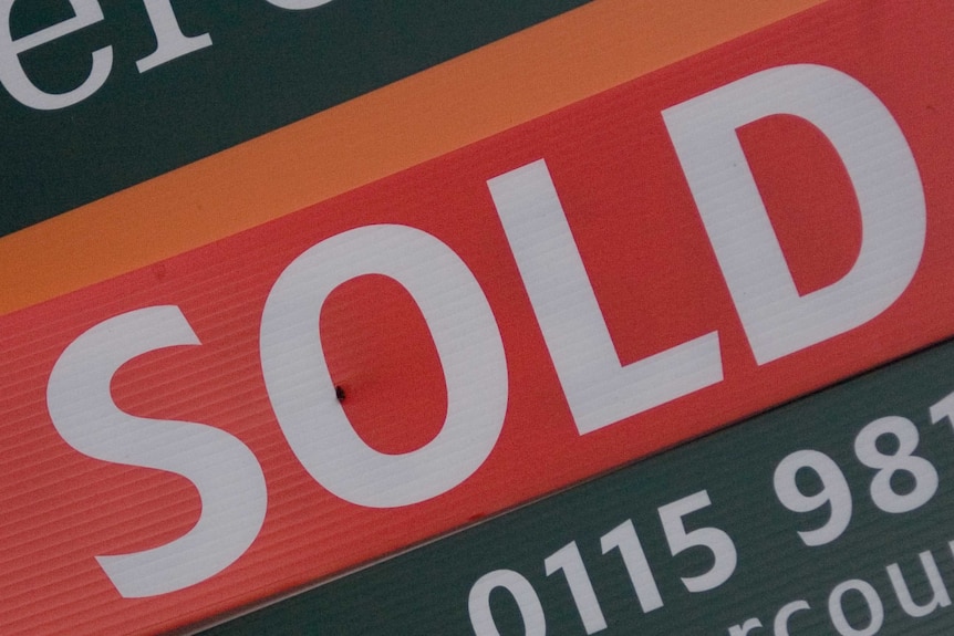 Sold sign on a house.