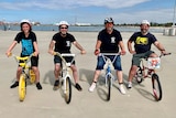 Four men on BMX bikes.