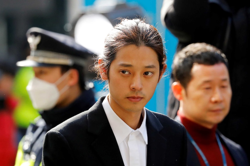 South Korean singer Jung Joon-young arrives for questioning at the Seoul Metropolitan Police Agency in Seoul, South Korea.