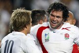 Calf injury ... Andy Farrell (r) during England's pool win over Tonga