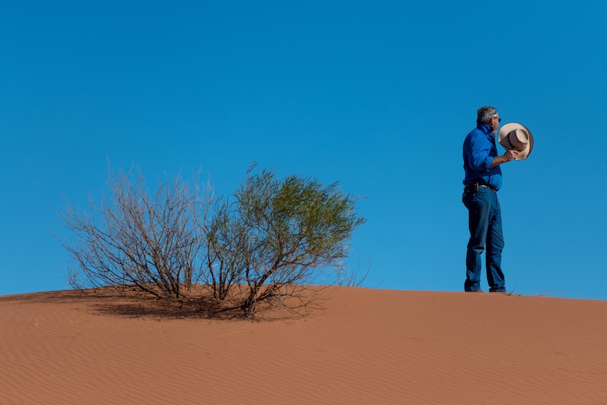 Nilpena Station cattle farmer Ross Fargher on a sandhill.