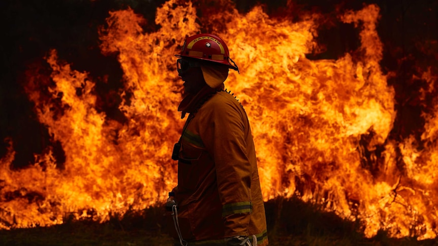 A fire fighter working on a controlled burn