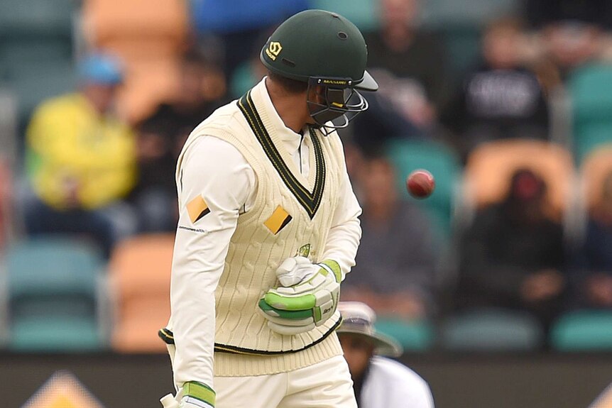 Australia's Usman Khawaja looks back after nicking the ball to the slips against South Africa in Hobart