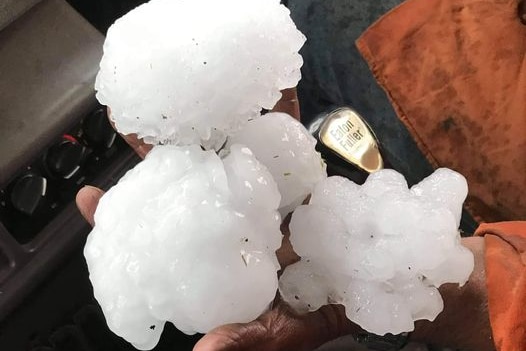 Large hail stones in a hand.