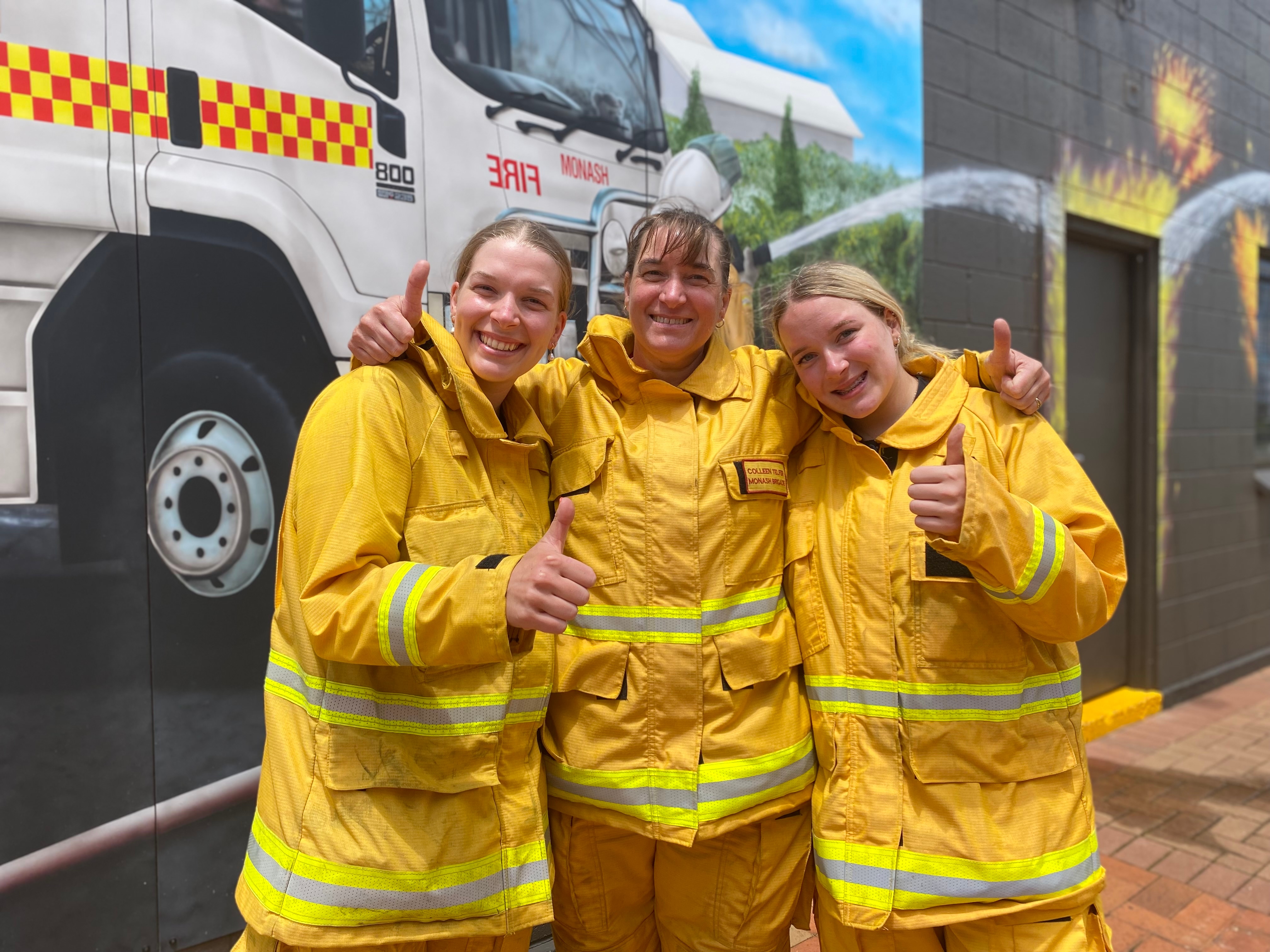 A mother and two daughters in protective gear