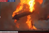 A rocket ship explodes in a fireball.