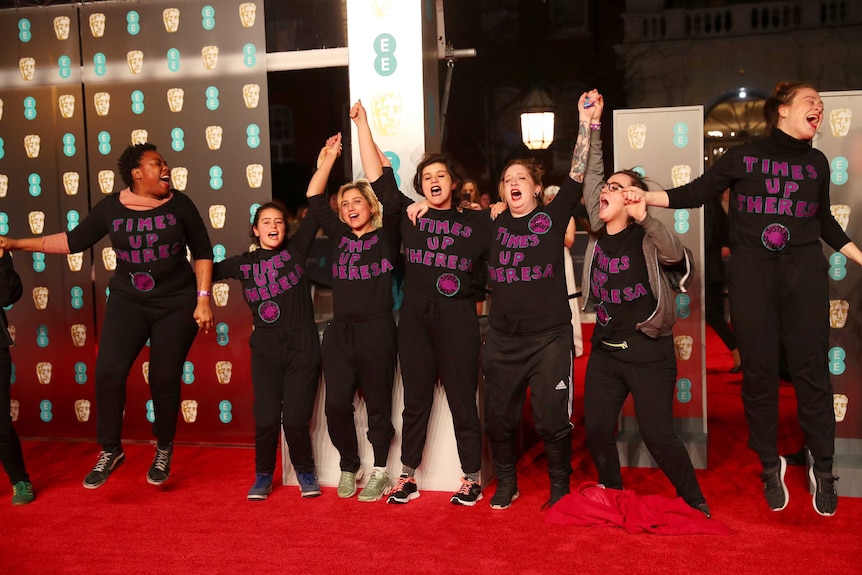 A group of Time's Up protesters on the BAFTAs red carpet