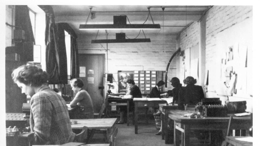 Women working to decipher German codes, inside of the Machine Room of Hut 6 at Bletchley Park.