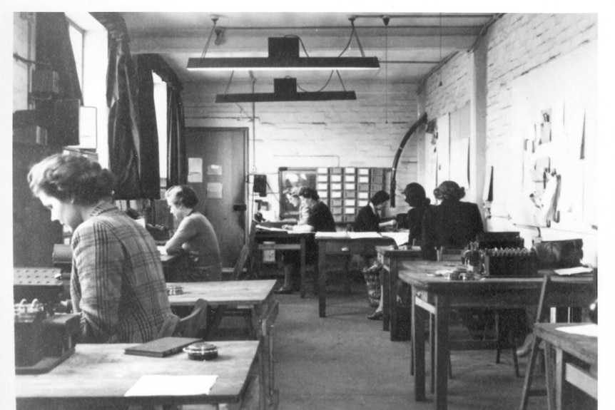 Women working to decipher German codes, inside of the Machine Room of Hut 6 at Bletchley Park.