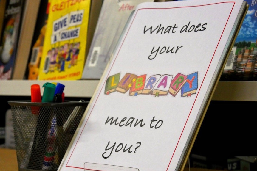 A close-up shot of a library sign reading 'What does your library mean to you?'