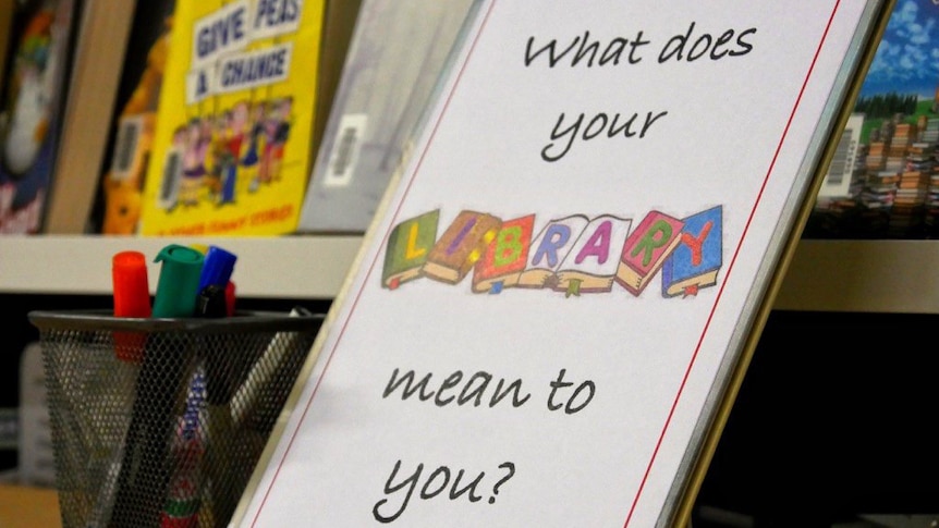 A close-up shot of a library sign reading 'What does your library mean to you?'