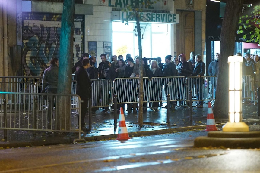 People line up outside the Bataclan concert hall.