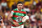 Latrell Mitchell runs with the ball for the SOuth Sydney Rabbitohs in an NRL game against the Brisbane Broncos.