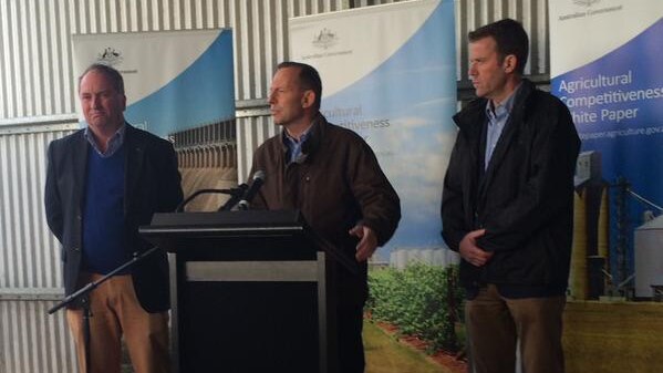 Agriculture Minister Barnaby Joyce and Prime Minister Tony Abbott in a woolshed.