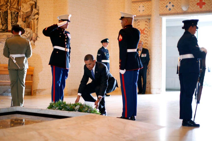 US President Barack Obama lays a wreath at the Tomb of the Unknown Soldier.