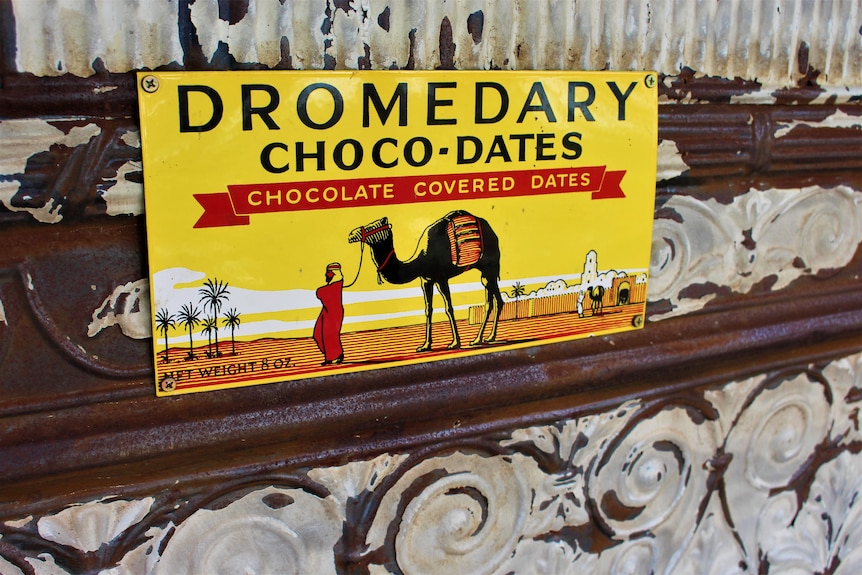 A old, brightly coloured food box with a picture of a camel.