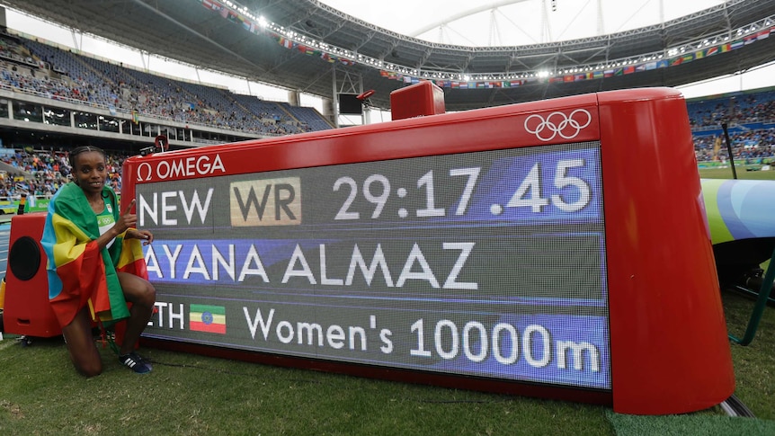 Almaz Ayana poses alongside her world record
