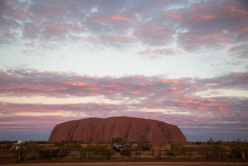 Near empty car parks with Uluru in the background