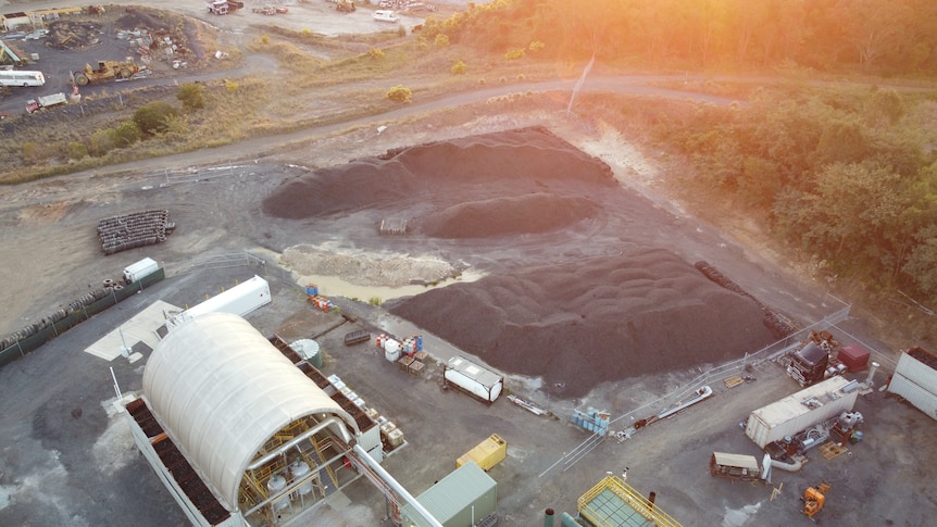 Chip Tyre site at New Chum from above, with the large stockpiles of tyres and tyre chip visible