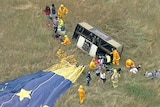 People are assessed by paramedics after a hot air balloon made a hard landing at Dixon's Creek.