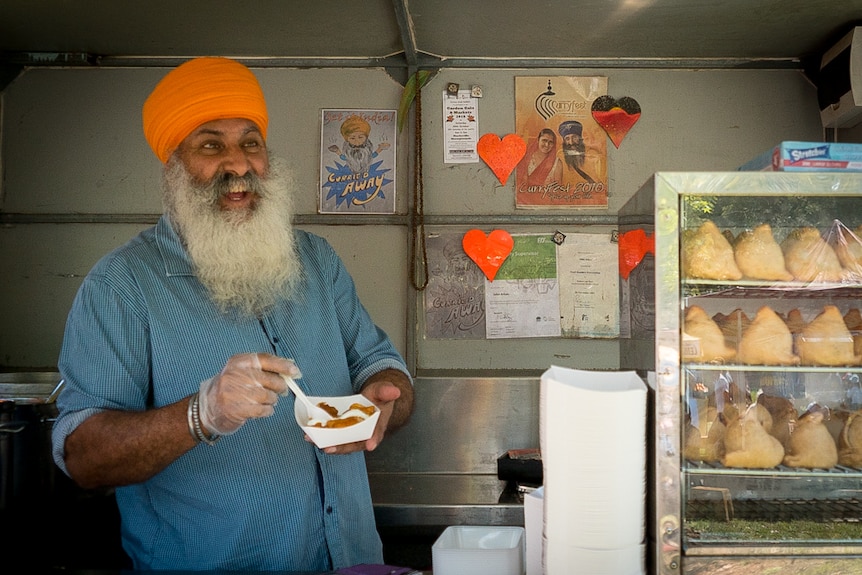 John Arkan at his Indian food stall.