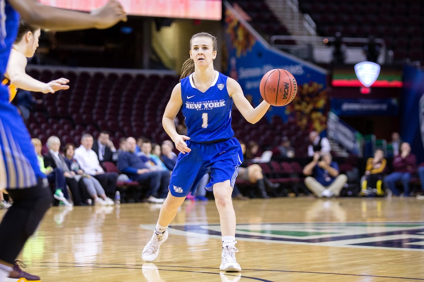 Stephanie Reid bounces the basketball while on court for the University of Buffalo.