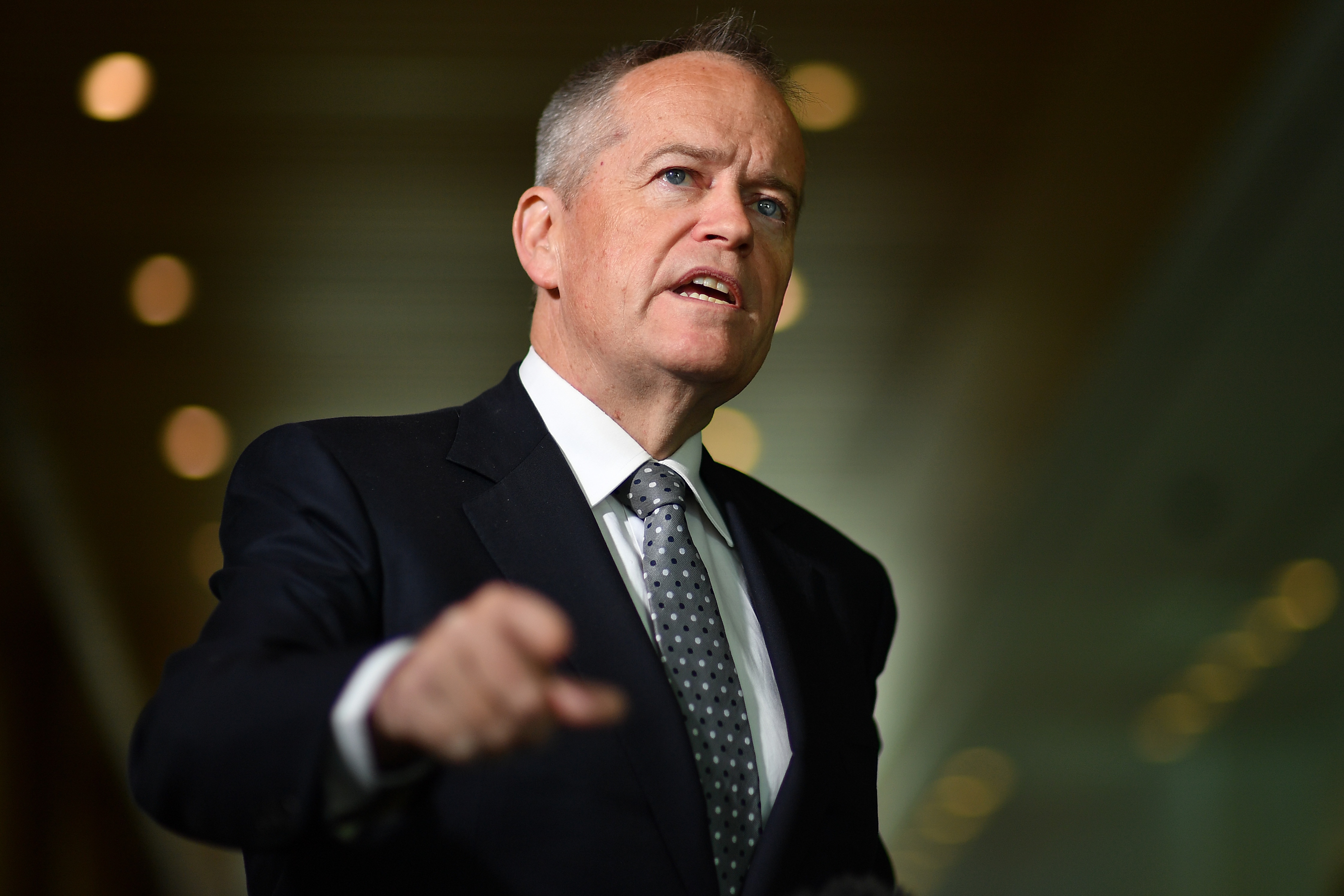 A middle aged politician pointing 