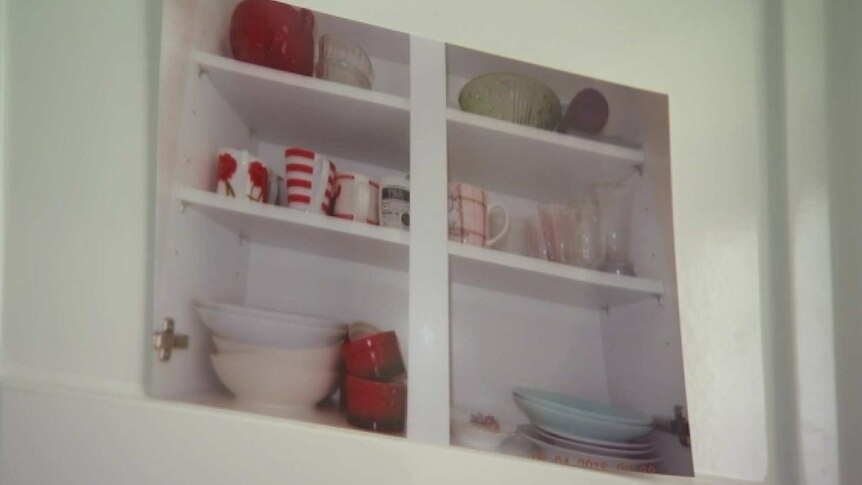 To help her remember what is in the cupboards, Wendy Mitchell photographs the contents and sticks it on the door