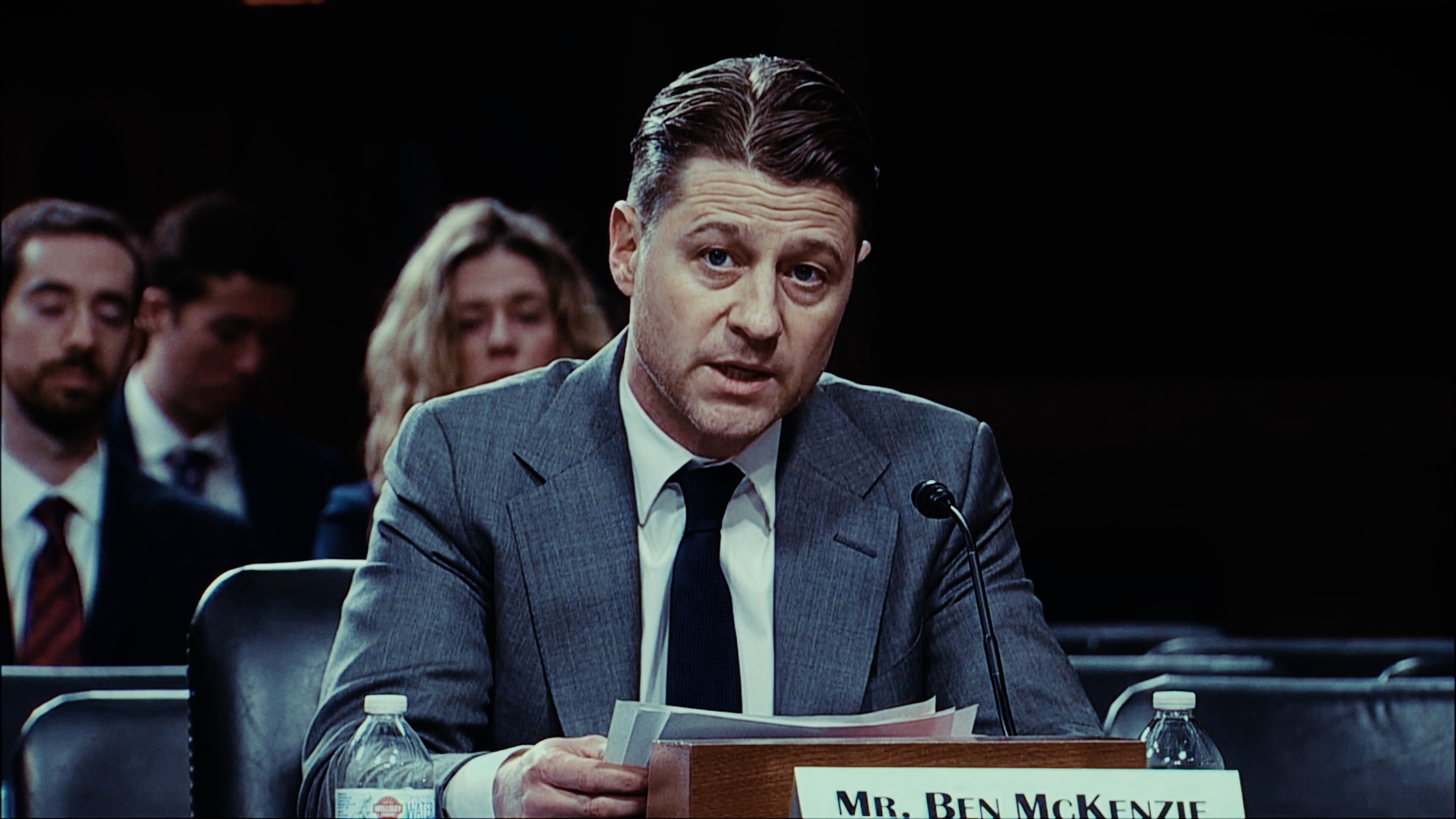 Ben McKenzie with a nameplate in front of him.