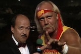 Gene Okerlund interviews Hulk Hogan at a WWE event.