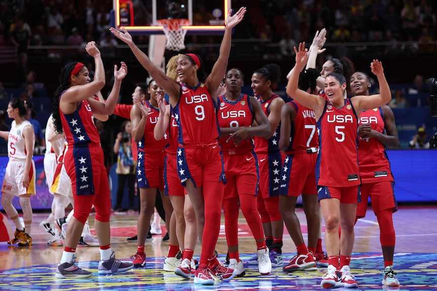 Team USA celebrate on court after winning the women's FIBA World Cup.