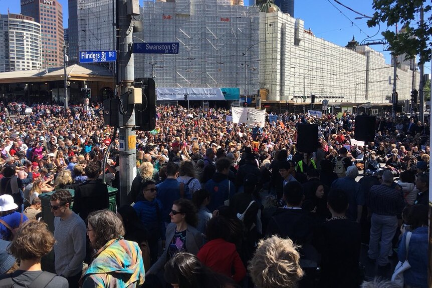 Protesters block Flinders St at a rally to show support for men on Manus Island.