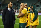 Wallabies coach Michael Cheika talks to captain Stephen Moore after Australia's loss to England