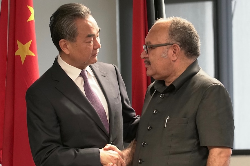 Chinese Foreign Minister Wang Yi with Papua New Guinea's Prime Minister Peter O'Neill.
