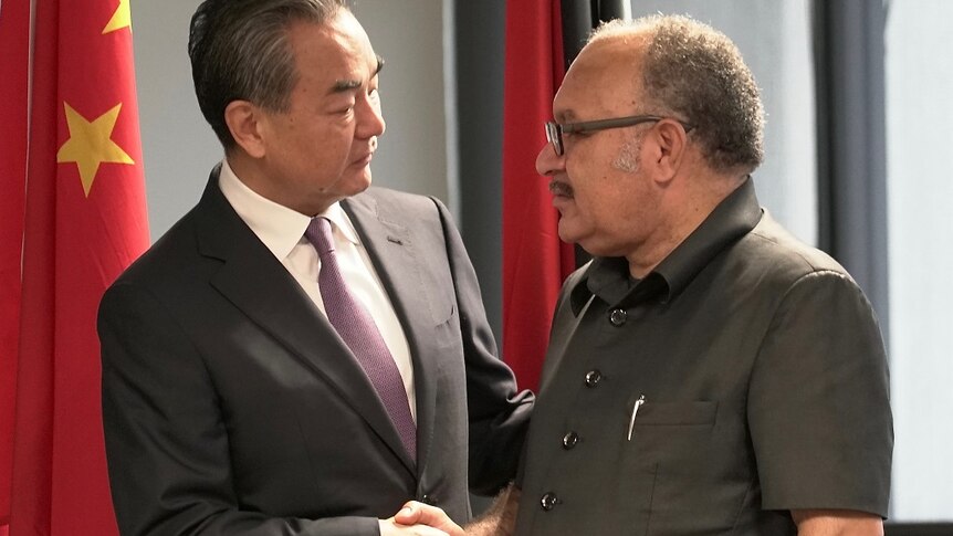 Chinese Foreign Minister Wang Yi with Papua New Guinea's Prime Minister Peter O'Neill.
