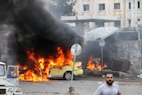 A car on fire after a bomb blast in Tartus.