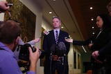 Mathias Cormann stands in a press conference.