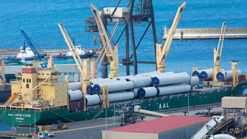 Wind farm towers awaiting raod transport.