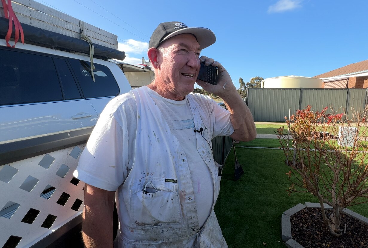 a painter on the phone 