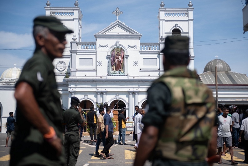 Security officers stand in front of St Anthony's Shrine in Colombo, Sri Lanka.